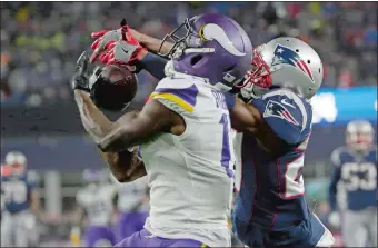  ?? STEVEN SENNE/AP PHOTO ?? New England defensive back J.C. Jackson, right, breaks up a pass intended for Minnesota’s Aldrick Robinson during Sunday’s game at Gillette Stadium in Foxborough, Mass.