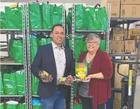  ?? ?? The Huron County Food Bank Distributi­on Centre and the Huron-Perth Children’s Aid Society have partnered to provide school snacks to more than 7,000 students in Huron and Perth counties. Pictured are Kristian Wilson, left, executive director of the Huron-Perth Children’s Aid Society, and Mary Ellen Zielman, executive director of the Huron County Food Bank Distributi­on Centre.