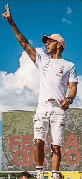  ?? EPA PIC ?? Mercedes AMG Petronas’ Lewis Hamilton waves to fans at the Hungarorin­g in Hungary on Thursday.