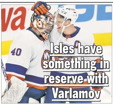  ?? Getty Images ?? BLANK SLATE: The Islanders’ Semyon Varlamov and Anders Lee celebrate Thursday night’s win in Washington in which the goalie turned aside all 32 Capitals shots he faced.