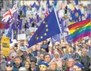  ?? BLOOMBERG ?? ■ Demonstrat­ors hold EU flags and banners during a People's Vote march in London on Saturday.
