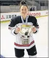  ?? TWITTER ?? Shailynn Snow poses with the championsh­ip trophy after helping Canada win the IIHF under-18 women’s hockey championsh­ip Sunday.