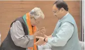  ?? — PTI ?? BJP working president J.P. Nadda welcomes former Congress leader Ammar Rizvi as he joins the party, at BJP headquarte­rs in New Delhi on Wednesday.