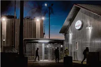  ?? Kirsten Luce/New York Times 2022 ?? Young workers leave a pork plant in Minnesota after a cleaning shift. The Biden administra­tion has announced a crackdown on the labor exploitati­on of migrant children around the nation.