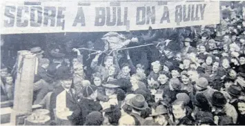  ??  ?? ●●People got the chance to throw books at an effigy of Adolph Hitler in Town Hall Square to round off a waste paper collection campaign