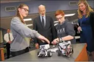  ?? GENE WALSH — DIGITAL FIRST MEDIA ?? Gov. Tom Wolf listens as students explain details of their robotic device during a visit to Colonial Middle School in Plymouth Wednesday.