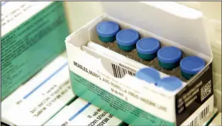  ?? AP/SETH WENIG ?? In this March 27 file photo, measles, mumps and rubella vaccines are seen in a cooler at the Rockland County Health Department in Pomona, N.Y.