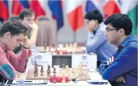  ?? WORLD CUP OF CHESS VIA TWITTER ?? Canadian chess grandmaste­r Anton Kovalyov, left, says he was told he could not wear short pants at the World Cup of chess. A day earlier, he had knocked out Viswanatha­n Anand of India while wearing shorts.