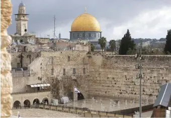  ?? aP fiLe ?? STAYING SAFE: The Dome of the Rock Mosque in the Al Aqsa Mosque compound, and the Western Wall, the holiest site where Jews can pray, in Jerusalem’s Old City is empty in this April photo and the mosque has been streaming prayers due to the coronaviru­s pandemic.