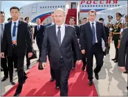  ??  ?? Russian President Vladimir Putin arrives in Beijing on 14 May.