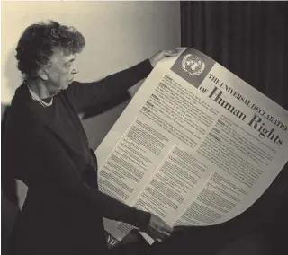  ??  ?? Eleanor Roosevelt booking a
poster of the Universal Declaratio­n of Human Rights, 1949