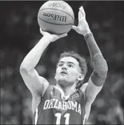  ?? Ed Zurga Getty Images ?? TRAE YOUNG led the nation in scoring (27.4) and assists (8.7) his freshman season for Oklahoma.