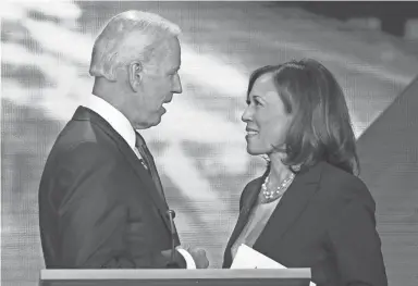  ??  ?? Former Vice President Joe Biden and Sen. Kamala Harris were competitor­s at Democratic primary debates but are now on the same team.