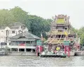  ??  ?? Cruising along the Chao Phraya River is a pleasant trip. You can spot beautiful attraction­s along the way including the Temple of Dawn, the Grand Palace, the Rama VIII Bridge, Guan Yu Shrine as well as the new Parliament House which looks like a grand temple due to its golden pagoda.