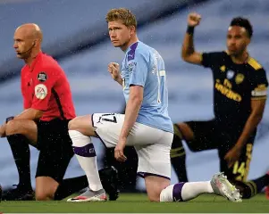  ??  ?? Solidarity...taking the knee at Manchester City and Villa Park, left