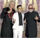  ??  ?? Brian May, Rami Malek and Roger Taylor at the movie’s premiere. May and Taylor were actively involved in its production.