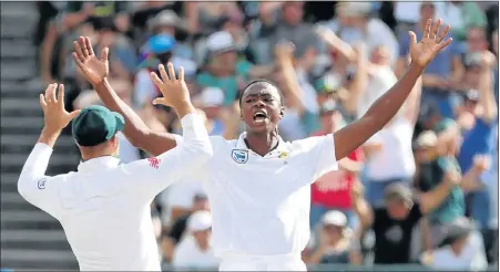  ?? Picture: REUTERS/MIKE HUTCHINGS ?? ON A ROLL: South Africa’s Kagiso Rabada celebrates taking the wicket of Australia’s David Warner on the fourth day of the third test at Newlands yesterday