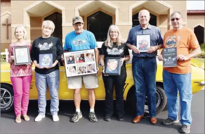  ?? STACI VANDAGRIFF/RIVER VALLEY & OZARK EDITION ?? Getting ready for the seventh annual Officer Will McGary Memorial Car Show in Searcy are, from left, Gail Hodges, Valley Baptist Church member; Robbi Casey, family friend and board member of the Officer Will McGary Memorial Foundation; the late Will McGary’s parents, Harold and Tanya McGary of Searcy; James Hays, board member and pastor of the church; and Jim Pinner, church member and car show founder. Will’s sister, Lindsey Montambaul­t of Searcy (not pictured), is on the foundation board, too, and helps with the car show. The car is Pinner’s 1969 Camaro SS convertibl­e. The car show is set for Sept. 28 at Get Down Downtown in Searcy. Will McGary was a Conway police officer.