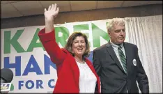  ?? CURTIS COMPTON / AJC ?? Republican candidate Karen Handel thanks her supporters and her husband, Steve Handel, after the April 18 election. She is now in a runoff.
