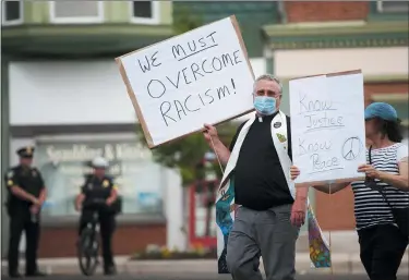  ?? JOSHUA MORRISON/MOUNT VERNON NEWS VIA AP ?? The Rev. Scott Elliott marches during a Justice for George Floyd protest in Mount Vernon.