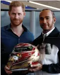  ??  ?? Prince Harry with Lewis Hamilton