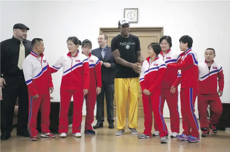  ?? — THE ASSOCIATED PRESS FILES ?? Former NBA basketball star Dennis Rodman poses with North Korean Olympic athletes in Pyongyang during his visit earlier this month.