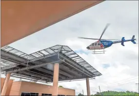  ?? Ryan Smith, Atrium Health Floyd, File ?? A Life Force helicopter arrives at the emergency department helipad at Atrium Health Floyd.
