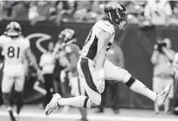 ?? Brett Coomer / Staff photograph­er ?? The Texans signed former Broncos running back Phillip Lindsay to a one-year contract, beefing up a backfield that includes veteran running back David Johnson, whose contract recently was restructur­ed.