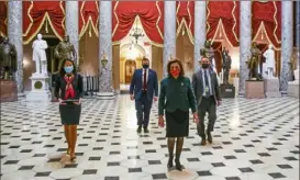  ?? Tasos Katopodis/Getty Images ?? Speaker of the House Nancy Pelosi on Monday after opening up the House floor. The House voted to override a veto on a $740 billion defense spending bill. It also voted in favor of sending $2,000 in direct payments to many Americans.