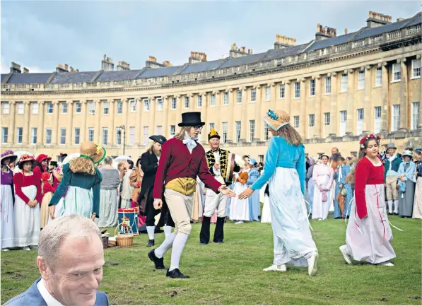  ??  ?? Donald Tusk, left, was unimpresse­d by Bath, which hosts an annual Jane Austen Regency Costumed Parade, above. Right, the Circus