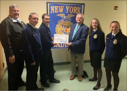  ?? SUBMITTED PHOTOS ?? The Madison FFA accepts check from CNY Farm Progress Show President Richard Presky. Pictured: FFA Scholarshi­p Coordinato­r Keith Schiebel, left, Student Advisor Maxx Simon, Treasurer Zachary Rollins, Presky, Secretary Anna McNamara, and Historian Emily Coffin.