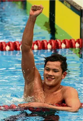  ??  ?? A winner: Arvin Shaun Singh of Terengganu celebratin­g after winning the 1,500m gold medal in the September Sukma in Perak. Now he is eyeing a place in the national swimming team.