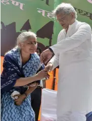  ?? — BUNNY SMITH ?? CPI( M) general secretary Sitaram Yechury ( right) with activist Medha Patkar during a protest rally against the Land Acquisitio­n Bill at Jantar Mantar in New Delhi on Tuesday.