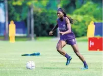  ?? ORLANDO PRIDE PHOTO ?? Pride forward Abi Kim makes a move with the ball during a training session.