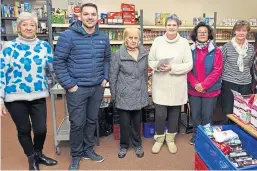  ??  ?? Staff drop off donations to Kirkcaldy foodbank volunteers.