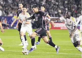  ?? ?? Inter Miami’s Lionel Messi (C) controls the ball against the Los Angeles Galaxy in the first half of a Major League Soccer match at Dignity Health Sports Park, Los Angeles, U.S., Feb. 25, 2024.