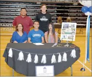  ?? Graham Thomas/Siloam Sunday ?? Siloam Springs senior midfielder Christian Marroquin signed a letter of intent Wednesday to play soccer at Crowder College in Neosho, Mo. Pictured are: Front from left, mother Elizabeth Marroquin, Christian Marroquin, sister Fernanda Marroquin; back, SSHS assistant coach Ehldane Labitad and head coach Luke Shoemaker.