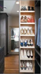  ?? STACY ZARIN GOLDBERG — CASE DESIGN VIA ASSOCIATED PRESS ?? A closet designed by Elena Eskandari, an interior designer specialist at Case Design. A retractabl­e shoe storage area in this closet keeps shoes organized and easily visible for the homeowner.