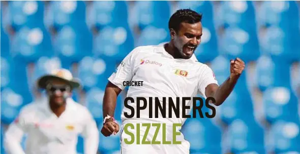  ?? REUTERS PIC ?? Sri Lanka’s Malinda Pushpakuma­ra celebrates after taking the wicket of India’s Ajinkya Rahane yesterday.