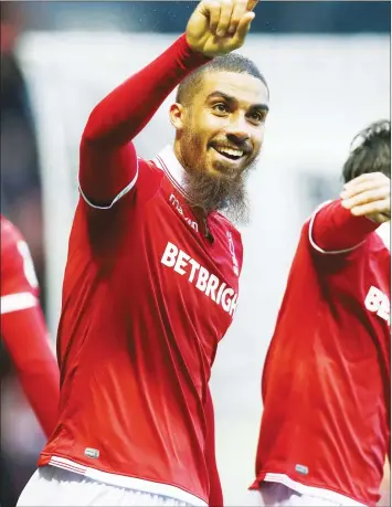  ??  ?? DOUBLING UP: Lewis Grabban celebrates scoring Forest’s second