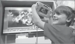  ?? BLOOMBERG ?? A boy reacts as he plays Super Mario Maker, developed and published by Nintendo Co for the Wii U, at the Legends of Gaming Live event in London.