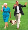  ?? Scott Applewhite / Associated Press 1992 ?? President George H.W. Bush and first lady Barbara Bush walk with Millie outside the White House in 1992.