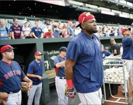  ?? NICK WASS — THE ASSOCIATED PRESS ?? Boston Red Sox’ s David Ortiz, center, walks to the field before a baseball game against the Baltimore Orioles, Tuesday in Baltimore.