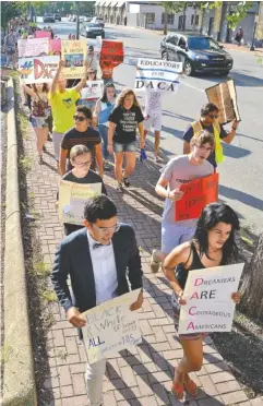  ?? STAFF PHOTO BY ROBIN RUDD ?? Marchers in an event sponsored by the Tennessee Immigrant and Refugee Rights Coalition walk Saturday in support of the Deferred Action for Childhood Arrivals program.