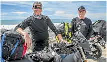  ??  ?? Tim Johnston, from Masterton, left, and Matthew Cockroft, from Hamilton, await the opening of State Highway 1 north of Kaiko¯ ura yesterday morning.