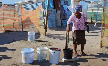  ?? PICTURE: SISONKE MLAMLA ?? RESIDENTS TAKE A STAND: Ntombozuko Vena of Siyahlala informal settlement in Khayelitsh­a collects water from a tap installed by the community.