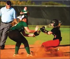  ?? File-LARRY GREESON / For the Calhoun Times ?? Sonoravill­e's Harleigh Chastain (right) is tagged out at second during a game earlier this season.