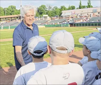  ?? Lori Van Buren / Albany Times Union ?? Former Senate Majority Leader Joe Bruno shakes hands with boys from Twin Town Little League before throwing out the first pitch at a Tri-city Valleycats baseball game at Joe Bruno Stadium in 2014.