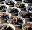  ?? HOANG DINH NAM/GETTY IMAGES ?? Plates of fried insects, including crickets and grasshoppe­rs, for sale at a local market in Vientiane.