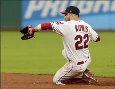  ?? TONY DEJAK — THE ASSOCIATED PRESS ?? The Indians’ Jason Kipnis fields a ball hit by the Twins’ Eduardo Escobar during the eighth inning.